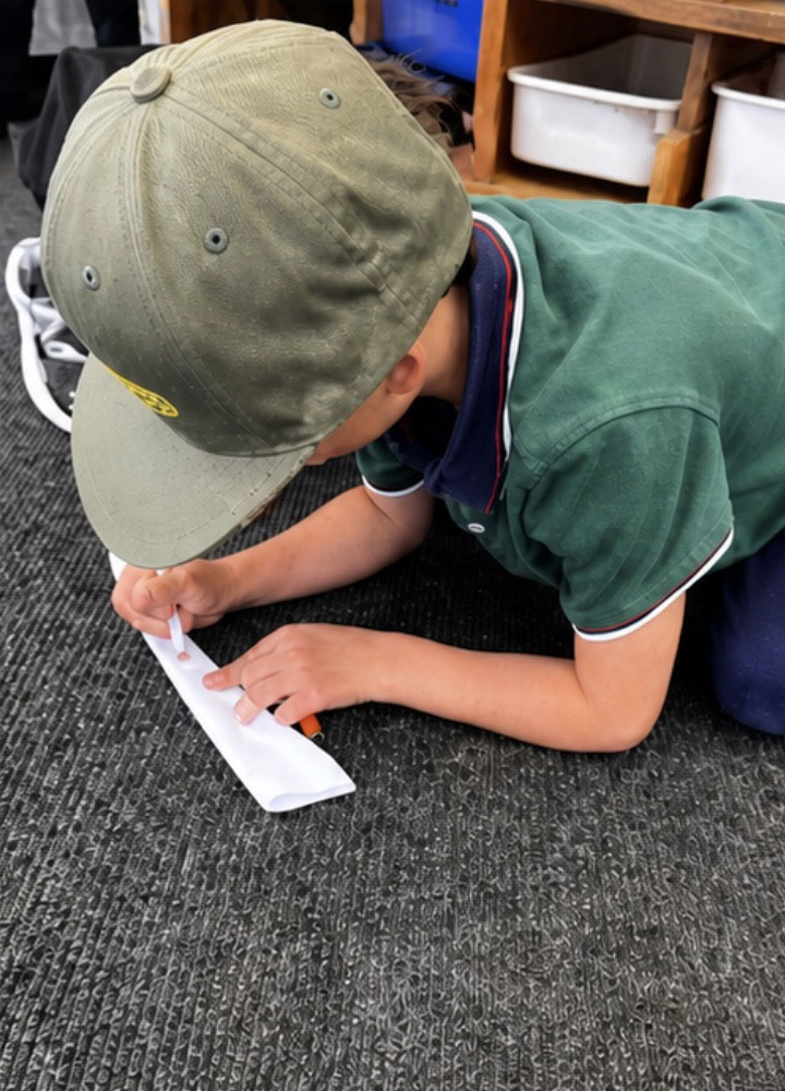 Kids building paper airplanes